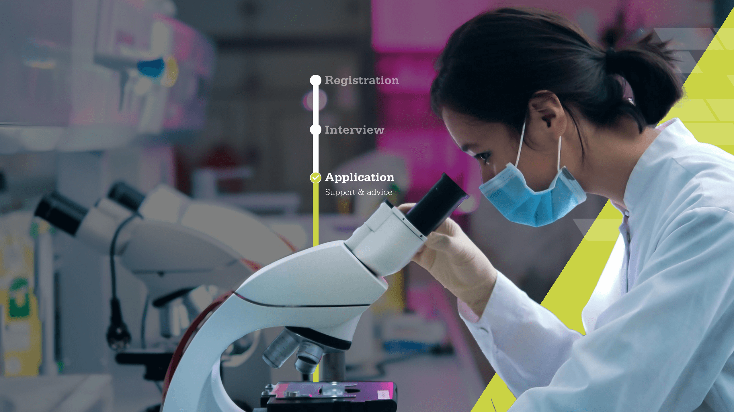 person looking into microscope